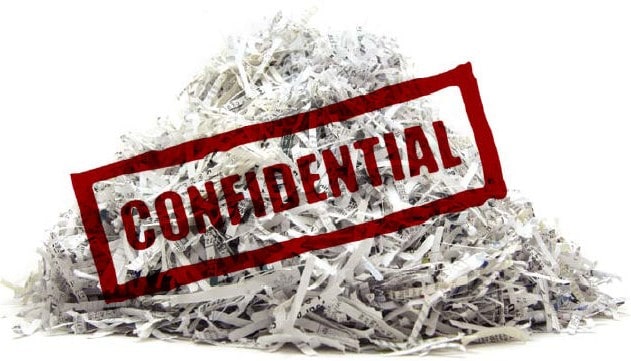 shredding financial documents to prevent identity theft