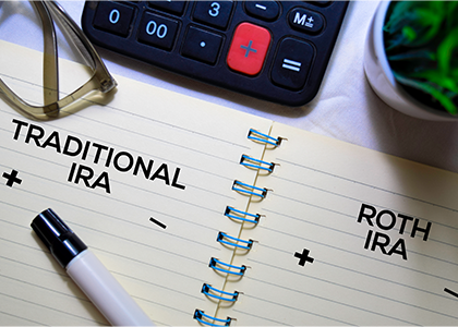 Notebook with the words traditional ira and roth ira